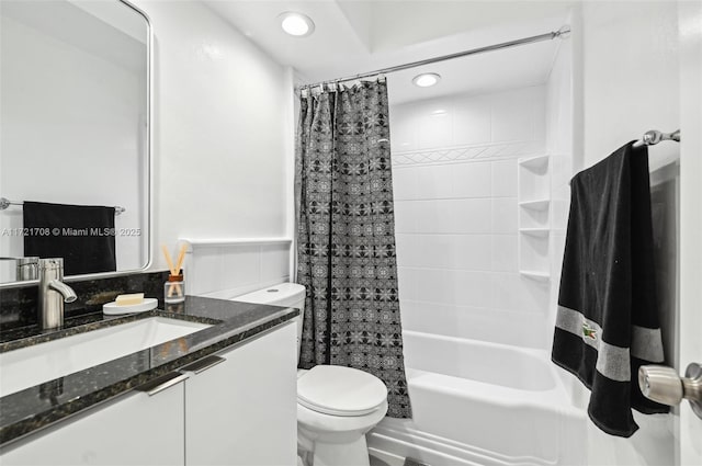 full bathroom with shower / bath combo with shower curtain, vanity, tile walls, and toilet