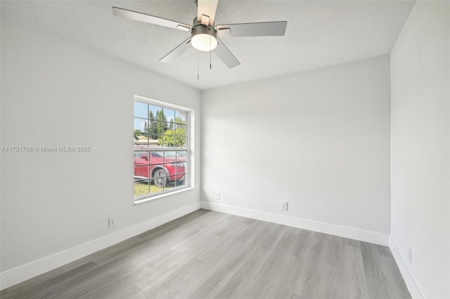 unfurnished room featuring ceiling fan and light hardwood / wood-style floors