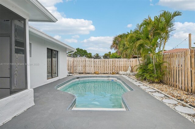 view of swimming pool with a patio area