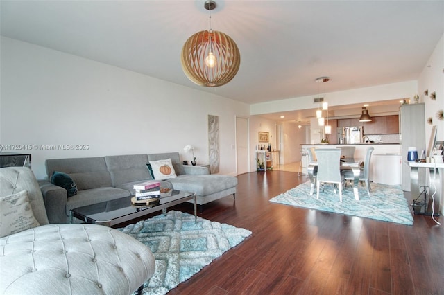 living room featuring dark hardwood / wood-style flooring