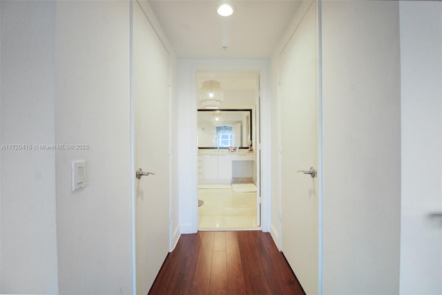 hall with dark hardwood / wood-style flooring