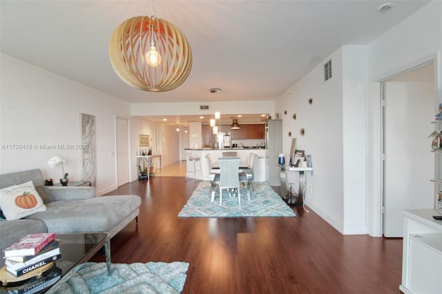 living room with dark wood-type flooring