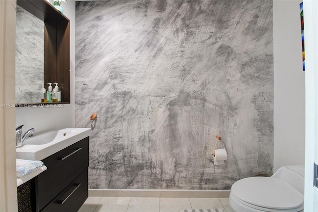 bathroom featuring tile patterned flooring, vanity, and toilet