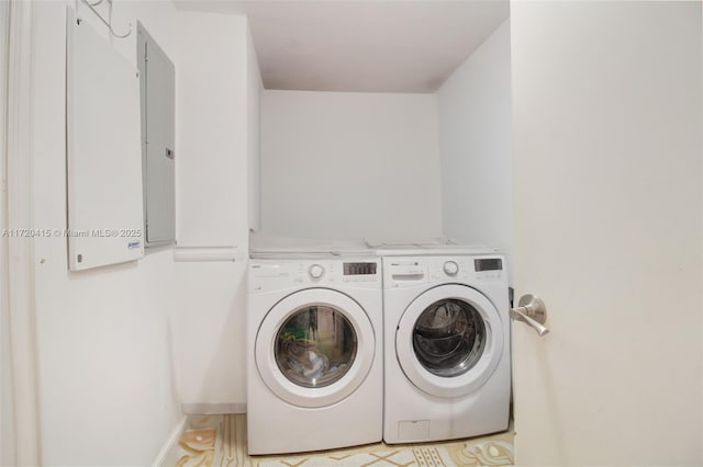 clothes washing area with washing machine and clothes dryer