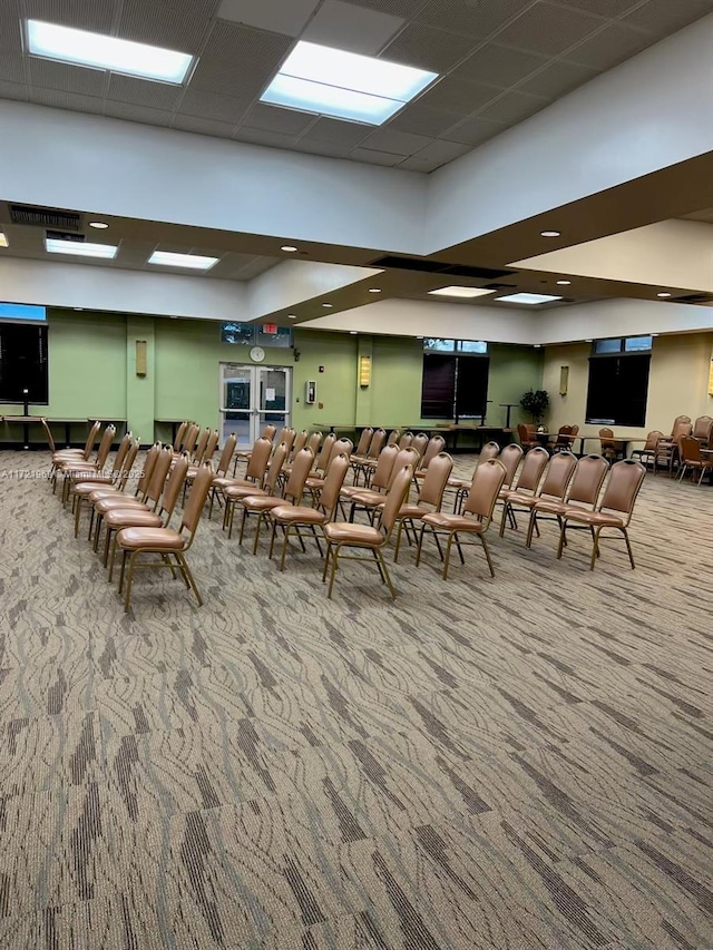 interior space with a paneled ceiling