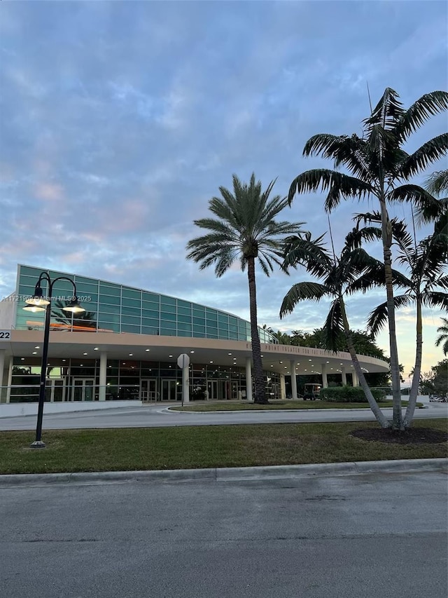 view of outdoor building at dusk