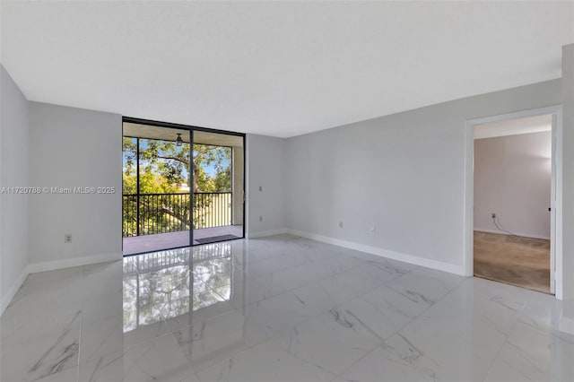 empty room featuring expansive windows