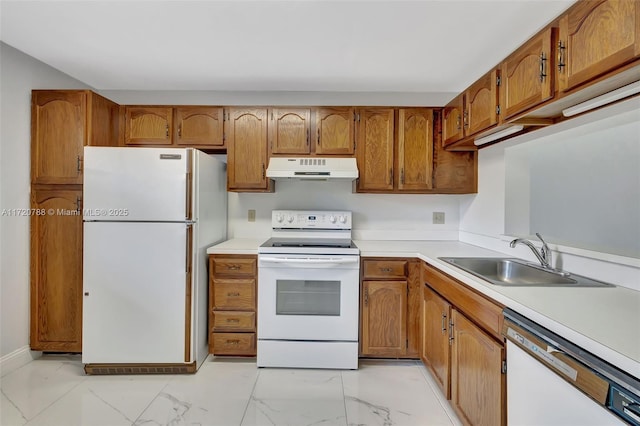 kitchen featuring white appliances and sink