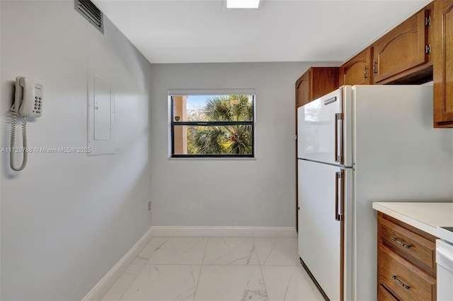 kitchen featuring white refrigerator