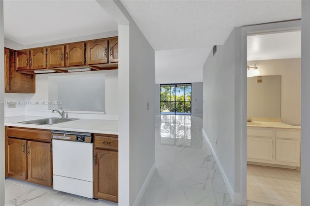 kitchen featuring dishwasher and sink