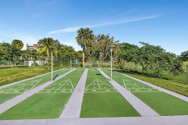 view of property's community featuring a yard