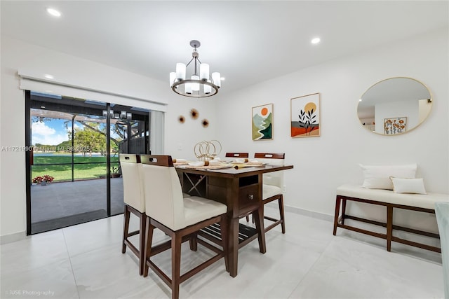 dining area featuring an inviting chandelier