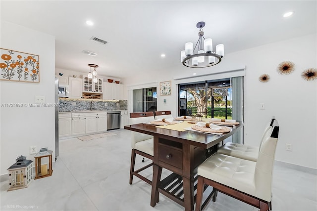 dining space featuring a notable chandelier