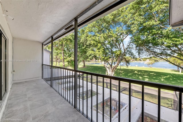 balcony featuring a water view