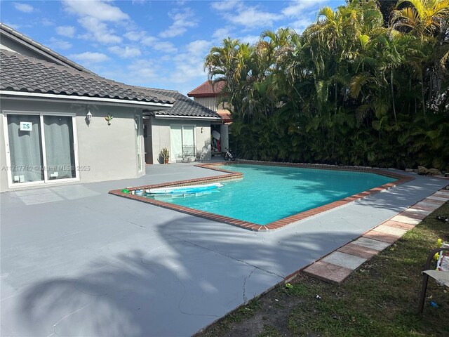 view of pool featuring a patio