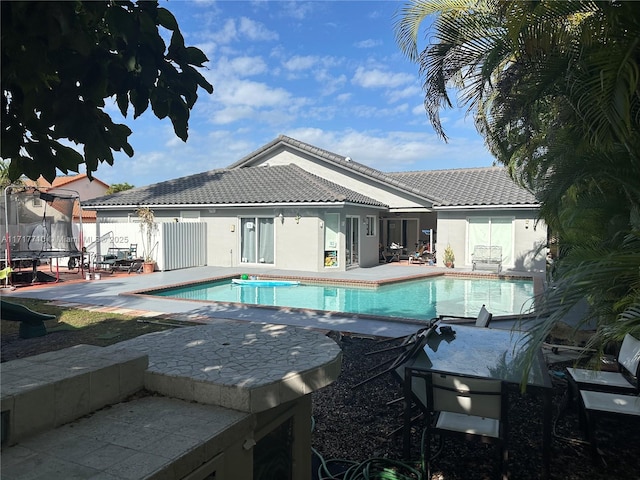 10331 SW 135th Ct, Miami, FL 33186 - view of swimming pool with a patio and a trampoline