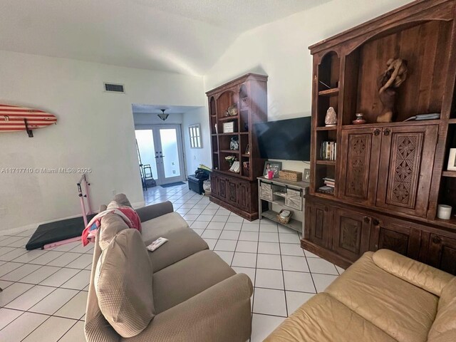 10331 SW 135th Ct, Miami, FL 33186 - living room featuring light tile patterned floors, lofted ceiling, and french doors