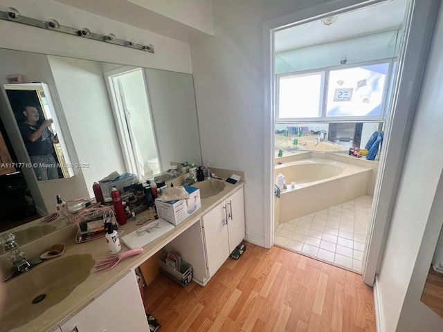 10331 SW 135th Ct, Miami, FL 33186 - bathroom featuring hardwood / wood-style floors, a tub to relax in, vanity, and toilet