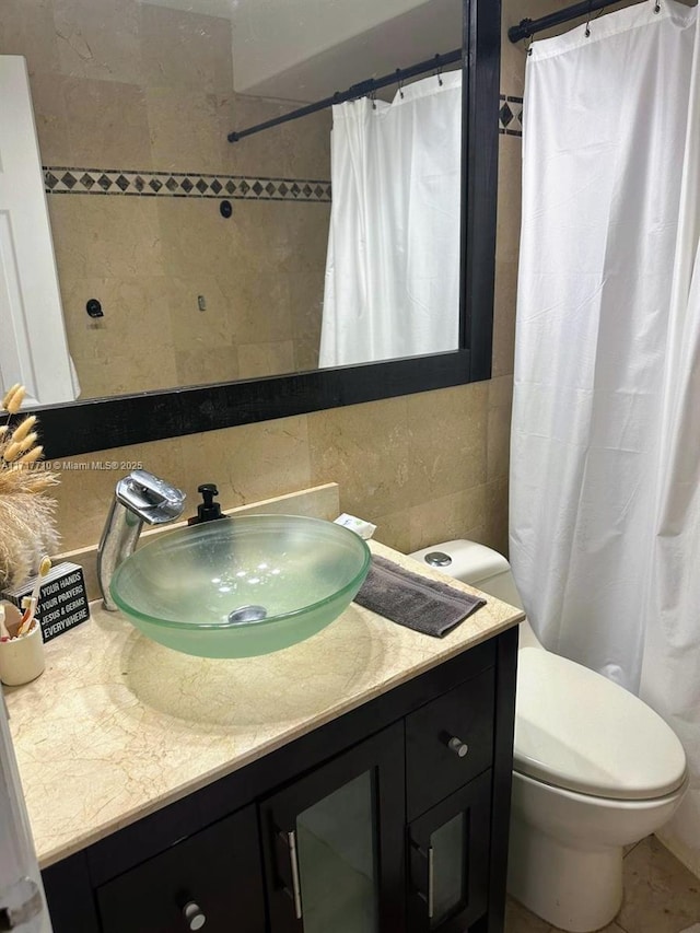 10331 SW 135th Ct, Miami, FL 33186 - bathroom with toilet, tile walls, a shower with shower curtain, vanity, and backsplash