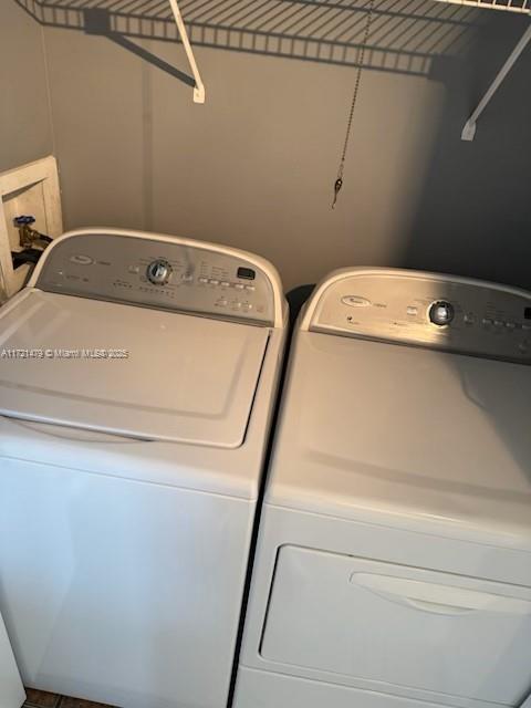 3426 Theo Way Unit 3426, West Palm Beach, FL 33417 - laundry room with washer and dryer