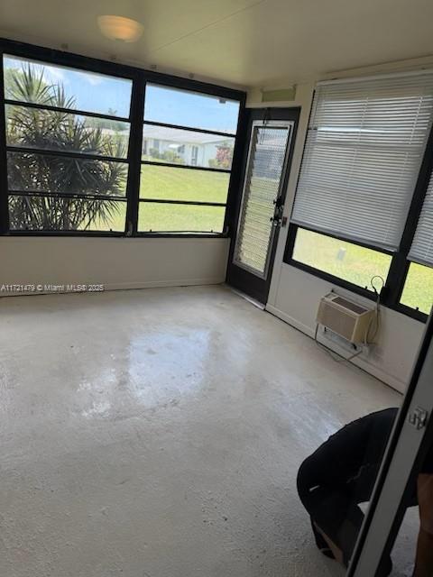 3426 Theo Way Unit 3426, West Palm Beach, FL 33417 - unfurnished sunroom with a wall mounted AC