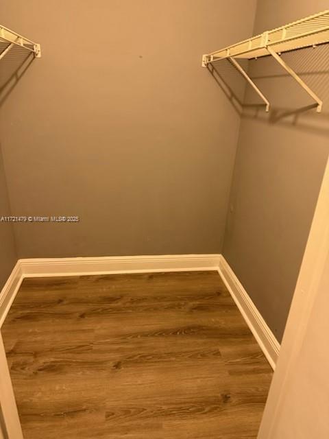 3426 Theo Way Unit 3426, West Palm Beach, FL 33417 - spacious closet with wood finished floors