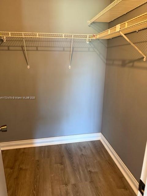 3426 Theo Way Unit 3426, West Palm Beach, FL 33417 - spacious closet featuring wood finished floors