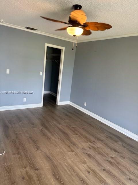 3426 Theo Way Unit 3426, West Palm Beach, FL 33417 - unfurnished room with ceiling fan, crown molding, a textured ceiling, dark wood finished floors, and baseboards