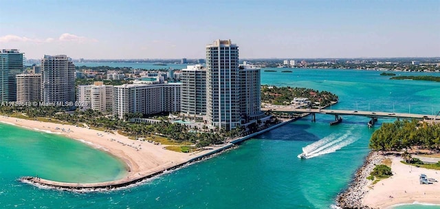 bird's eye view featuring a water view and a view of the beach