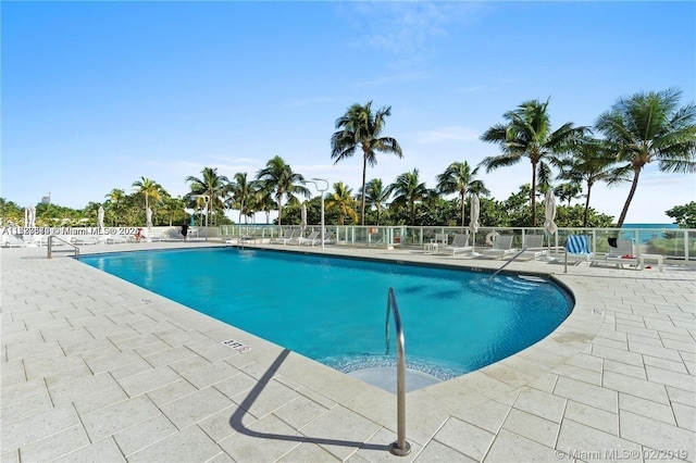 view of swimming pool with a patio area