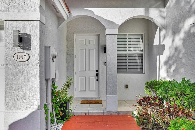 mediterranean / spanish-style house with a garage