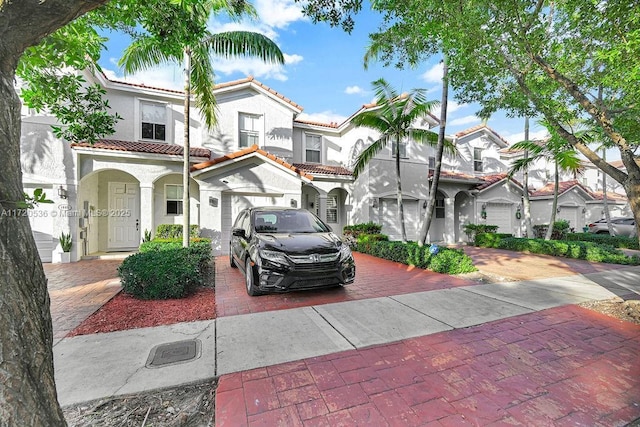 mediterranean / spanish-style home featuring a garage