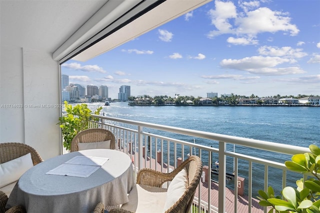 balcony featuring a water view