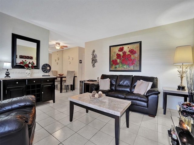 tiled living room featuring ceiling fan