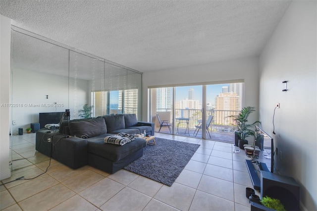 living room with light tile patterned floors and a textured ceiling