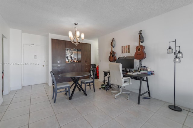 dining area with light tile patterned flooring, a textured ceiling, and a notable chandelier