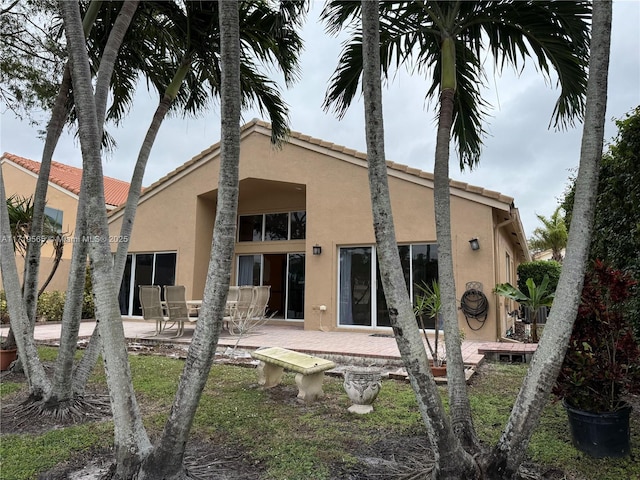 rear view of property featuring a patio