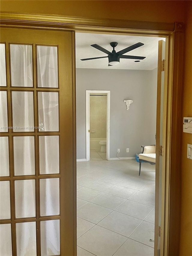 hallway with light tile patterned floors