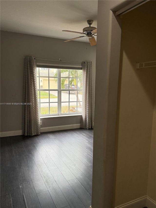 spare room featuring ceiling fan and hardwood / wood-style flooring