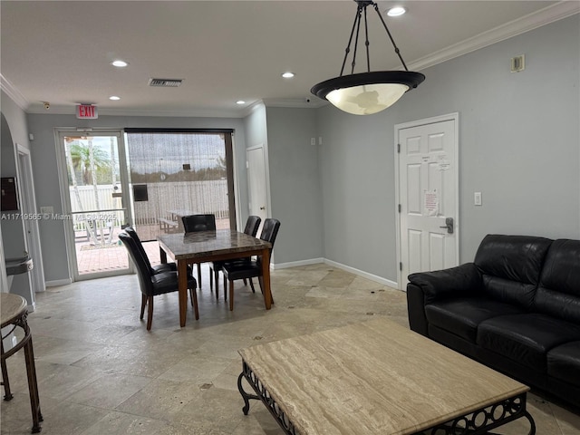 dining area with crown molding