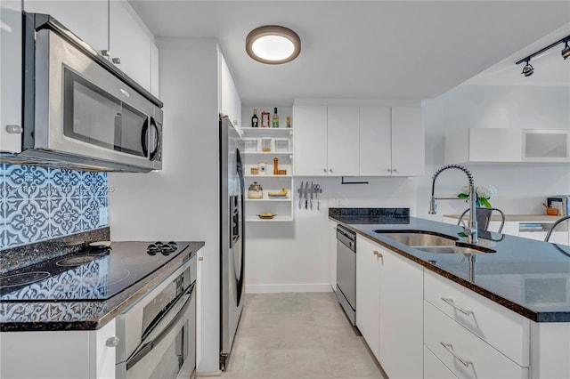 kitchen featuring sink, white cabinets, and appliances with stainless steel finishes