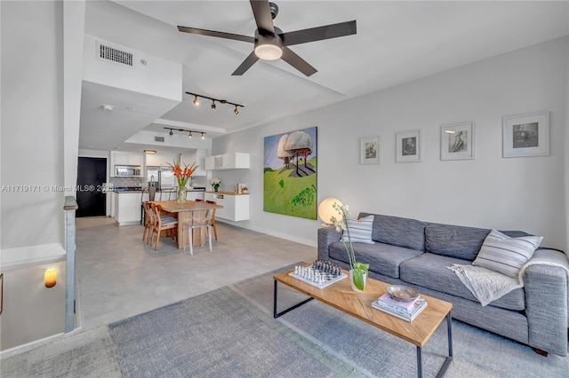 living room with ceiling fan