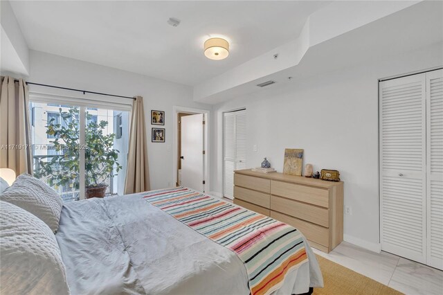 bedroom featuring two closets