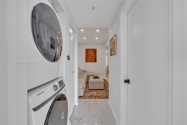 washroom with stacked washer / drying machine