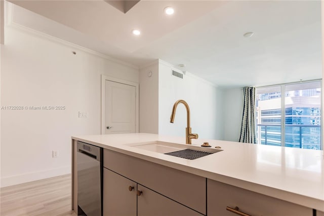 kitchen with crown molding, sink, stainless steel dishwasher, and light wood-type flooring