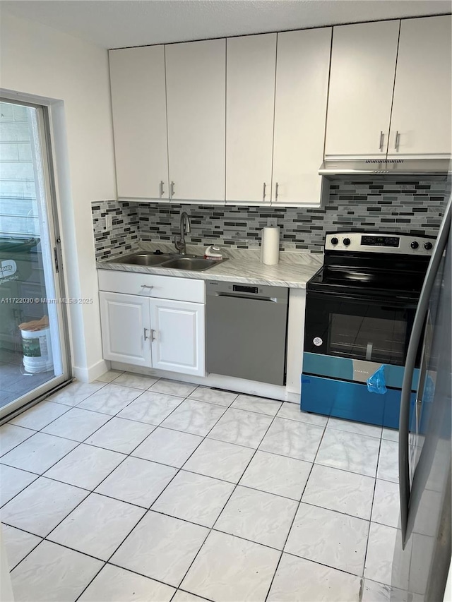 kitchen with range with electric stovetop, dishwasher, decorative backsplash, and sink