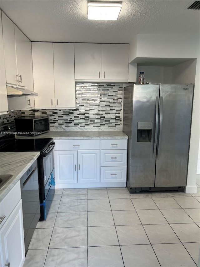 kitchen with black appliances, white cabinetry, decorative backsplash, and a textured ceiling