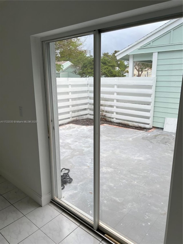 doorway featuring light tile patterned floors