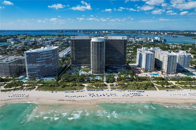 drone / aerial view with a beach view and a water view