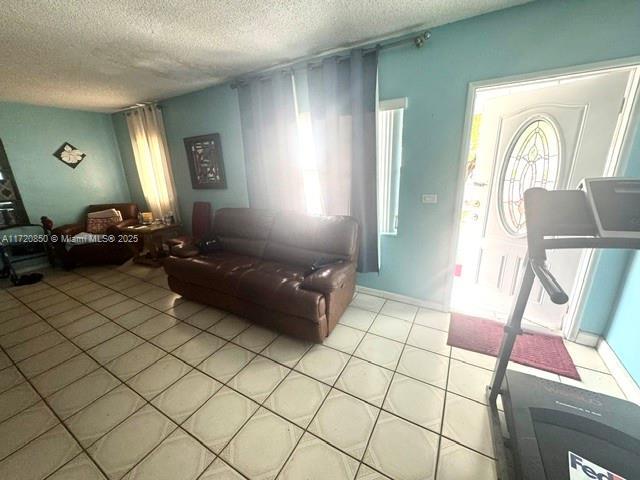 living room with a textured ceiling